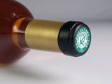 a close up of a bottle of wine with a starbucks logo on it
