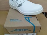 a white shoe that is sitting on top of a box