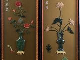 two framed pictures of flowers in a vase on the wall