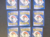 six packs of pokemon pikachu magnets on a black surface