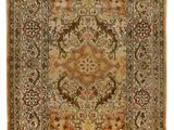 a rug with fringes hanging on a white wall