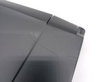 a close up of a broken laptop on a white surface