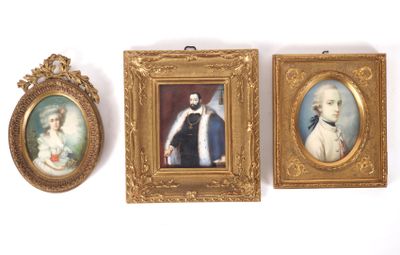 three framed portraits of men and women on a white wall