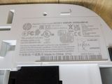 a close up of a white electronic device with a label on it