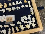 a picture of a display case with a lot of small figurines in it