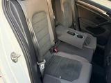 the back seats of a white car with black trims