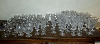 a lot of empty wine glasses sitting on a table
