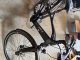 a man standing next to a bicycle in a garage