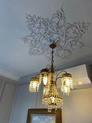 a chandelier hanging from the ceiling in a room