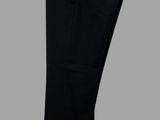 a pair of black pants hanging on a wooden hanger