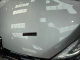 a close up of the hood of a car with a sticker on it