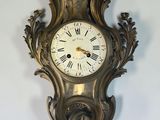 a clock hanging on the wall in the room
