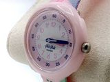 a pink wrist watch with a flower pattern on it