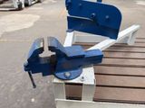 an image of a vise on a bench in a parking lot