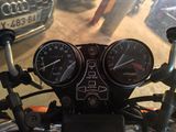 a close up of a motorcycle with a speedometer and gauges on it