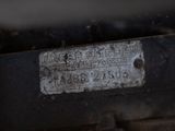 a close up of a metal plate on the back of a car