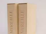 two books in a box on a white surface
