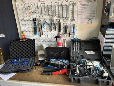 many tools on a workbench in a garage