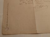 a piece of paper with writing on it sitting on a table