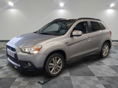 a picture of a silver suv parked in a garage