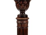 an image of a wooden pedestal with a planter on top of it