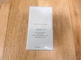 skinceuticals serum 10 serum in a plastic container on a wooden surface