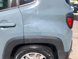 a car that has a tire on the side of the road
