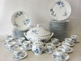 a lot of plates and cups and saucers on the table