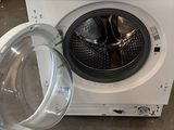 an image of a washing machine with the door open in a warehouse