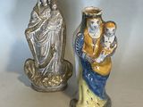 two figurines that are sitting on a table