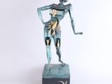 an image of a statue of a woman holding a cat