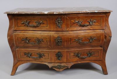 an old wooden chest of drawers with marble top