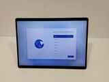 an image of a tablet computer with a screen showing a pie chart