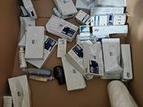 a cardboard box filled with many different types of electronic devices