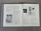 an open book with pictures of silverware on it