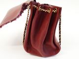 maroon leather purse with chain strap and flap closure