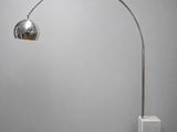 a chromed metal floor lamp with a marble base and a marble base