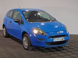 the small blue car is parked on the checkered floor