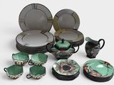 many plates, cups, and bowls that are sitting on a table