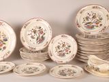 many plates and bowls that are sitting on a table
