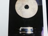 a picture of a picture of a clock on a table