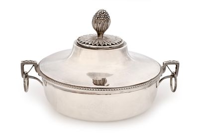 an antique silver plated casserole with a lid and handles