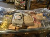 a plastic container filled with wooden toys in a store