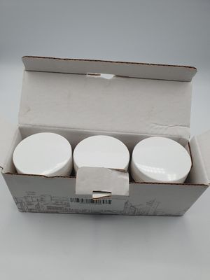 a box with three cups in it sitting on a table