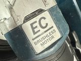 a close up view of a car ' s engine with a sticker on it