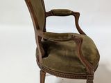 an image of a chair with a green upholstered seat on a white background