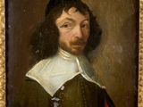 portrait of a man in a green and red dress with a white collar