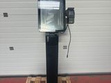 an image of a television on a stand in front of a garage