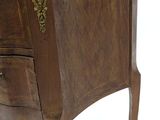 a small wooden table with a drawer on it
