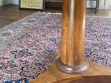 an image of a wooden table sitting on top of a rug